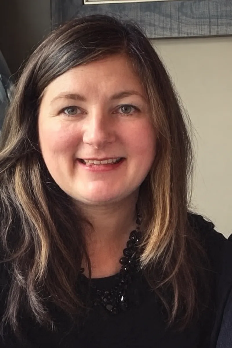 Kirstie, an event florist in Edinburgh, smiling.